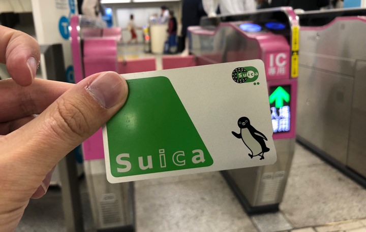 Holding a Suica card in the Tokyo subway