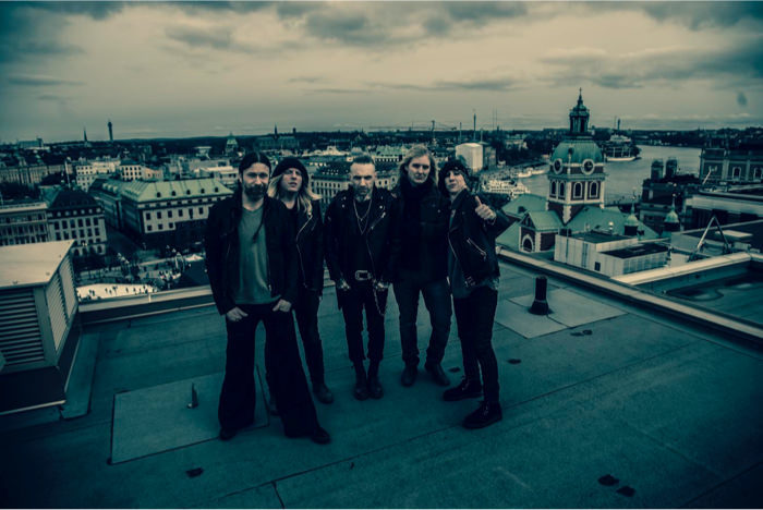 Backyard Babies and I standing on a rooftop in Stockholm.